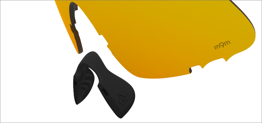Dual component nose piece with elastomeric nose gripping cradle anchored onto
M-CARBON nose paddles to provide a comfortable and secure non-slip fit.