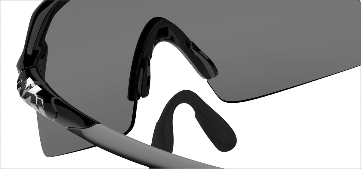 Dual component nose piece with elastomeric nose gripping cradle anchored onto
M-CARBON nose paddles to provide a comfortable and secure non-slip fit.