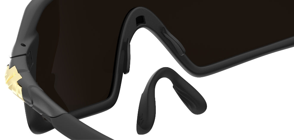 Dual component nose piece with elastomeric nose gripping cradle anchored onto
M-CARBON nose paddles to provide a comfortable and secure non-slip fit